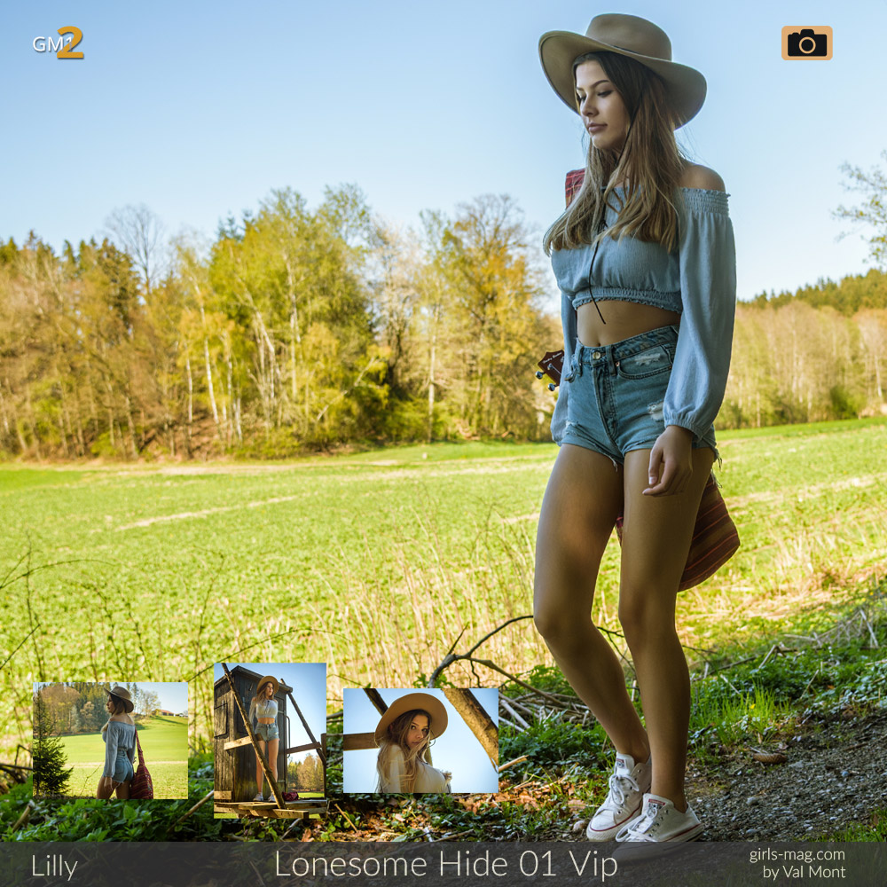Mädchen in denim Shorts und Stetson vor einer sonnigen Wiese